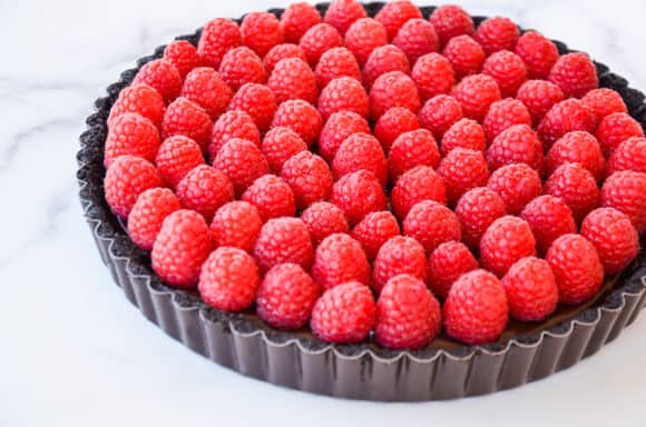 Fresh raspberries atop chocolate tart