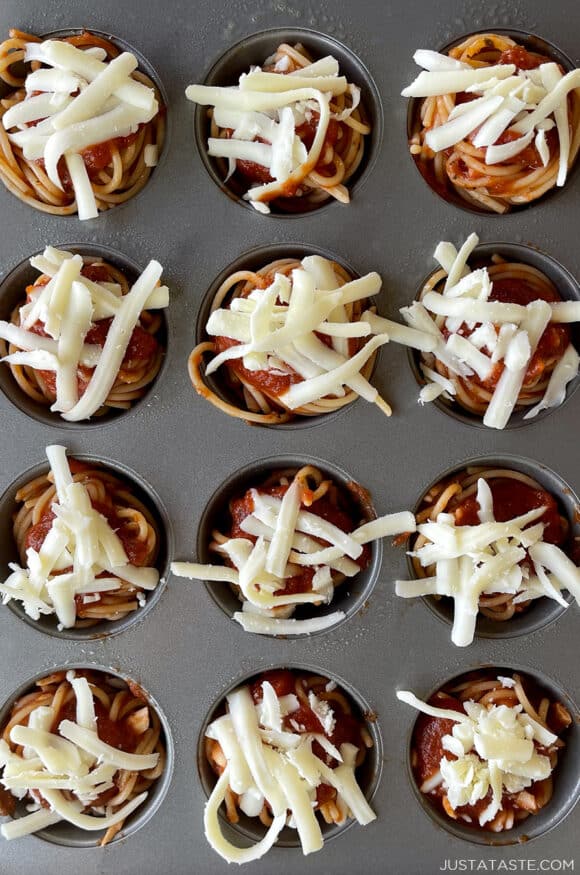 A view of a muffin pan containing spaghetti cupcakes