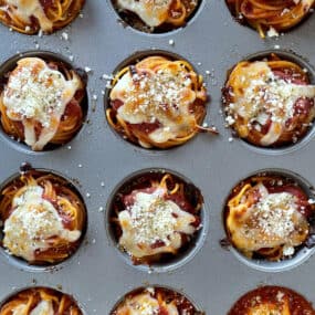 A top-down view of spaghetti cupcakes in a muffin pan