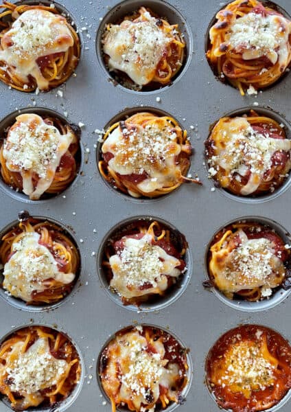 A top-down view of spaghetti cupcakes in a muffin pan
