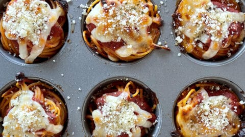A top-down view of spaghetti cupcakes in a muffin pan