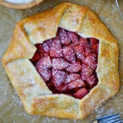 Top-down view of Simple Strawberry Galette dusted with powdered sugar