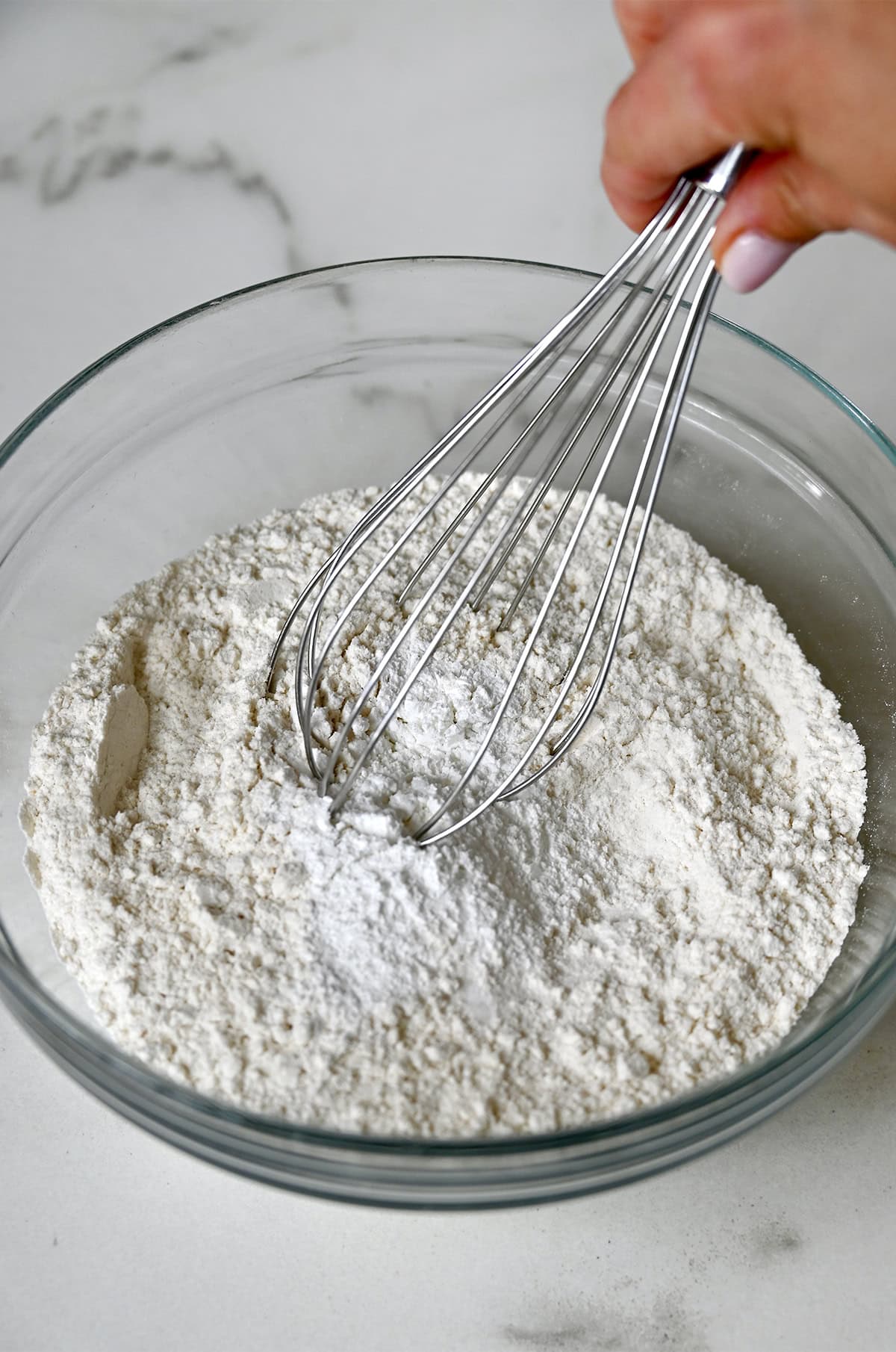 Whisking together dry ingredients for muffins.