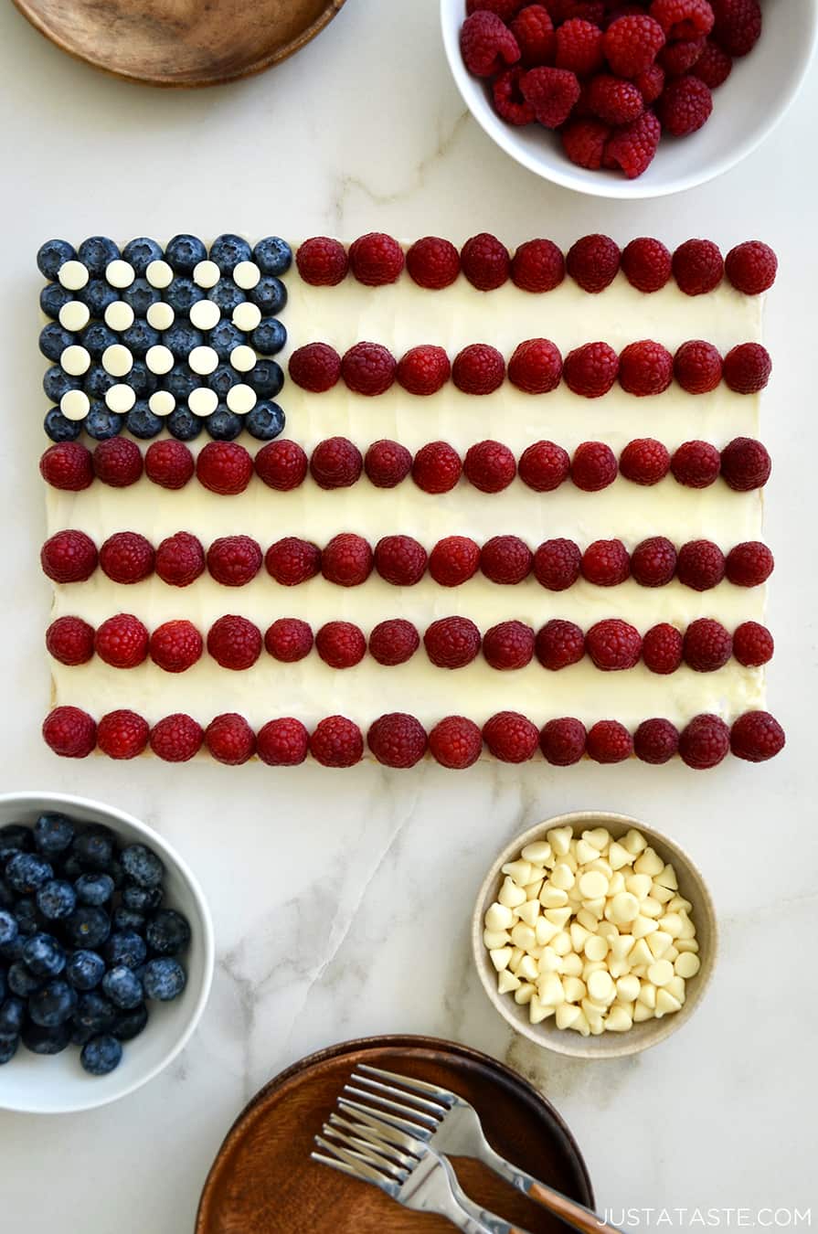 An American Flag Cookie Cake surrounded by bowls of berries