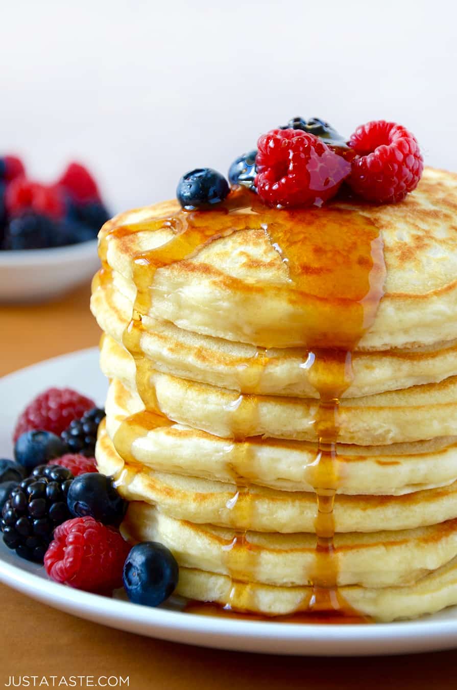 A stack of Greek Yogurt Pancakes topped with fruit
