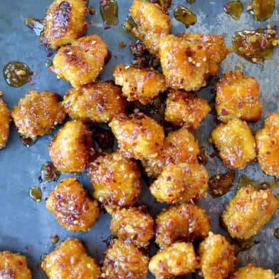 Baked Orange Chicken Poppers on a baking sheet