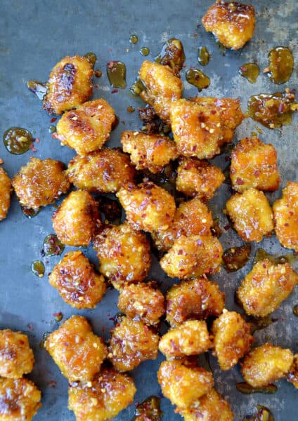 Baked Orange Chicken Poppers on a baking sheet