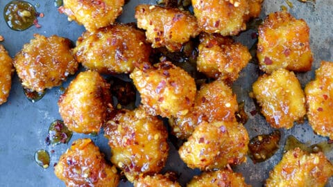 Baked Orange Chicken Poppers on a baking sheet