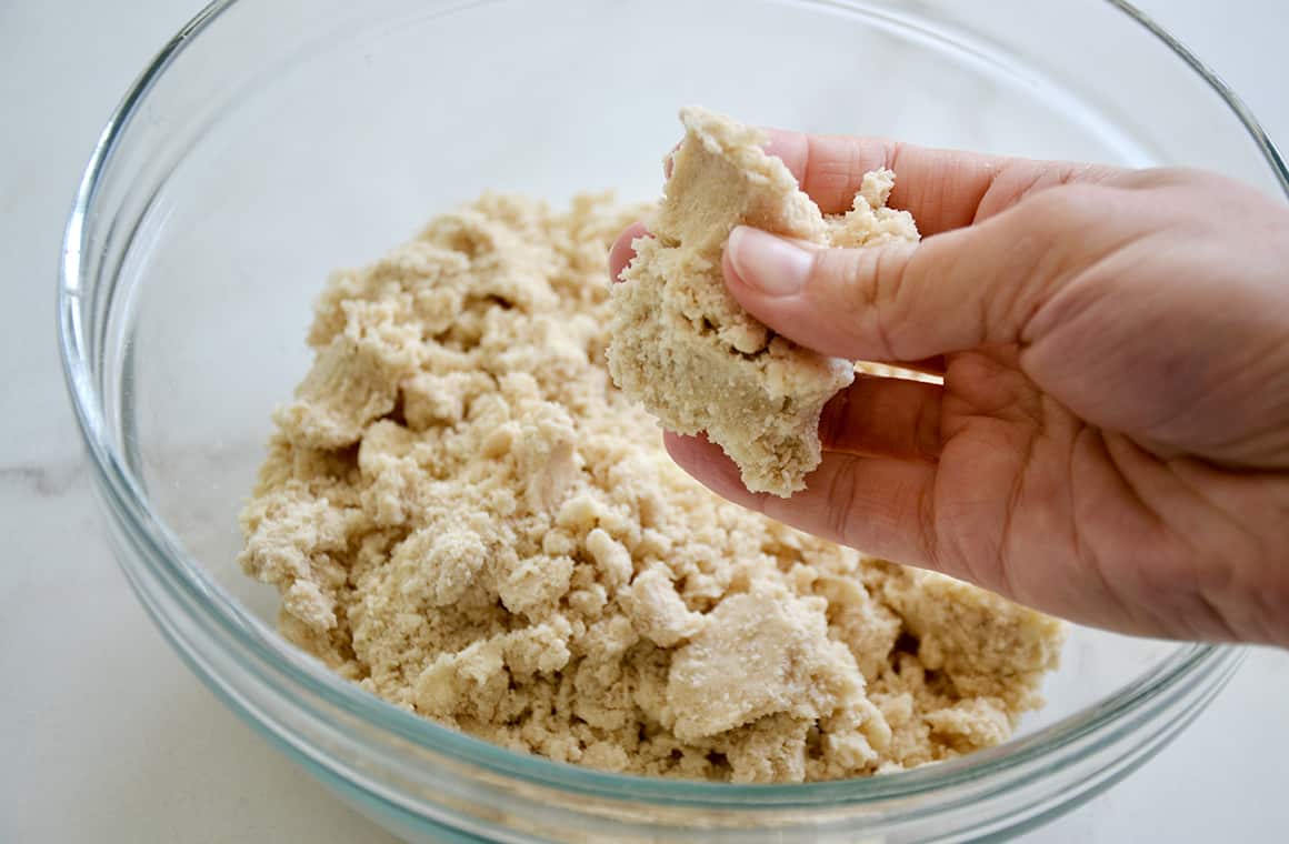 A glass bowl containing shortbread dough