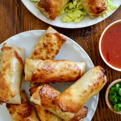 A top-down view of Air Fryer Egg Rolls on a white serving plate