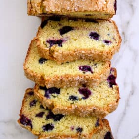 A top-down view of slices of Blueberry Orange Juice Bread