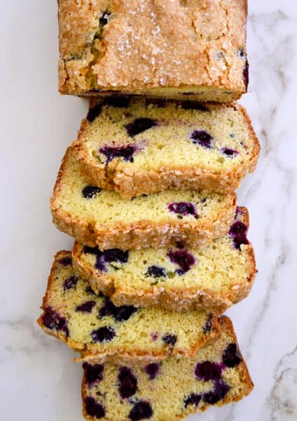 A top-down view of slices of Blueberry Orange Juice Bread