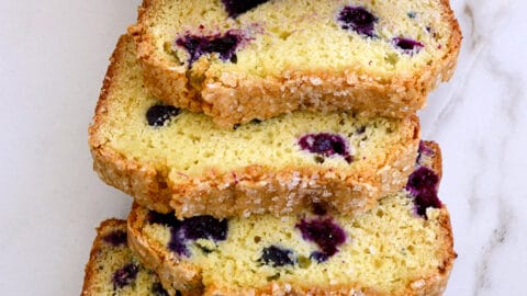 A top-down view of slices of Blueberry Orange Juice Bread