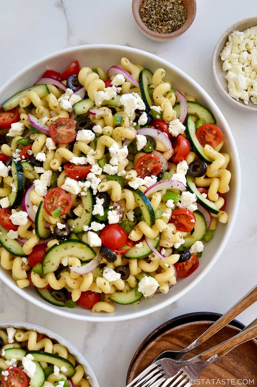 A bowl of Greek pasta salad topped with feta cheese