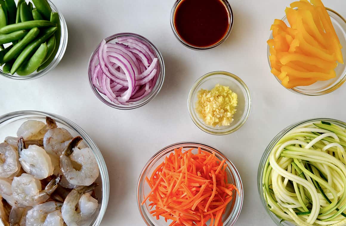 Glass bowls containing stir-fry ingredients