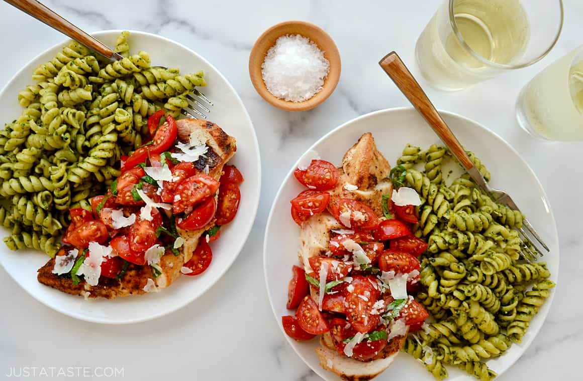 Chicken breasts topped with chopped tomatoes, basil and shredded Parmesan cheese