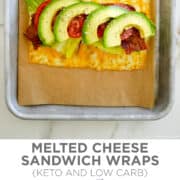 Top image: A top-down view of melted cheese topped with deli meat, lettuce, bacon, tomato and avocado atop a parchment paper-lined baking sheet. Bottom image: A Melted Cheese Sandwich Wrap.