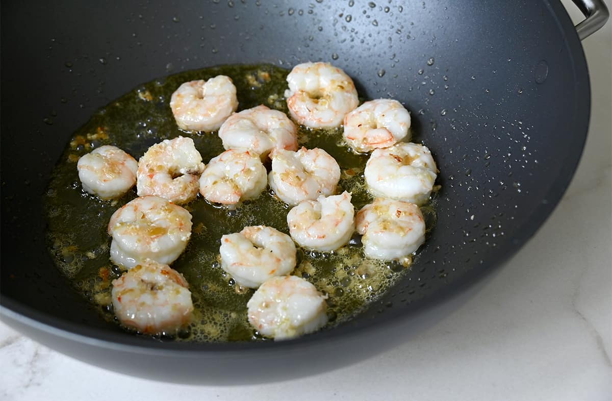 Sautéed shrimp in a wok.