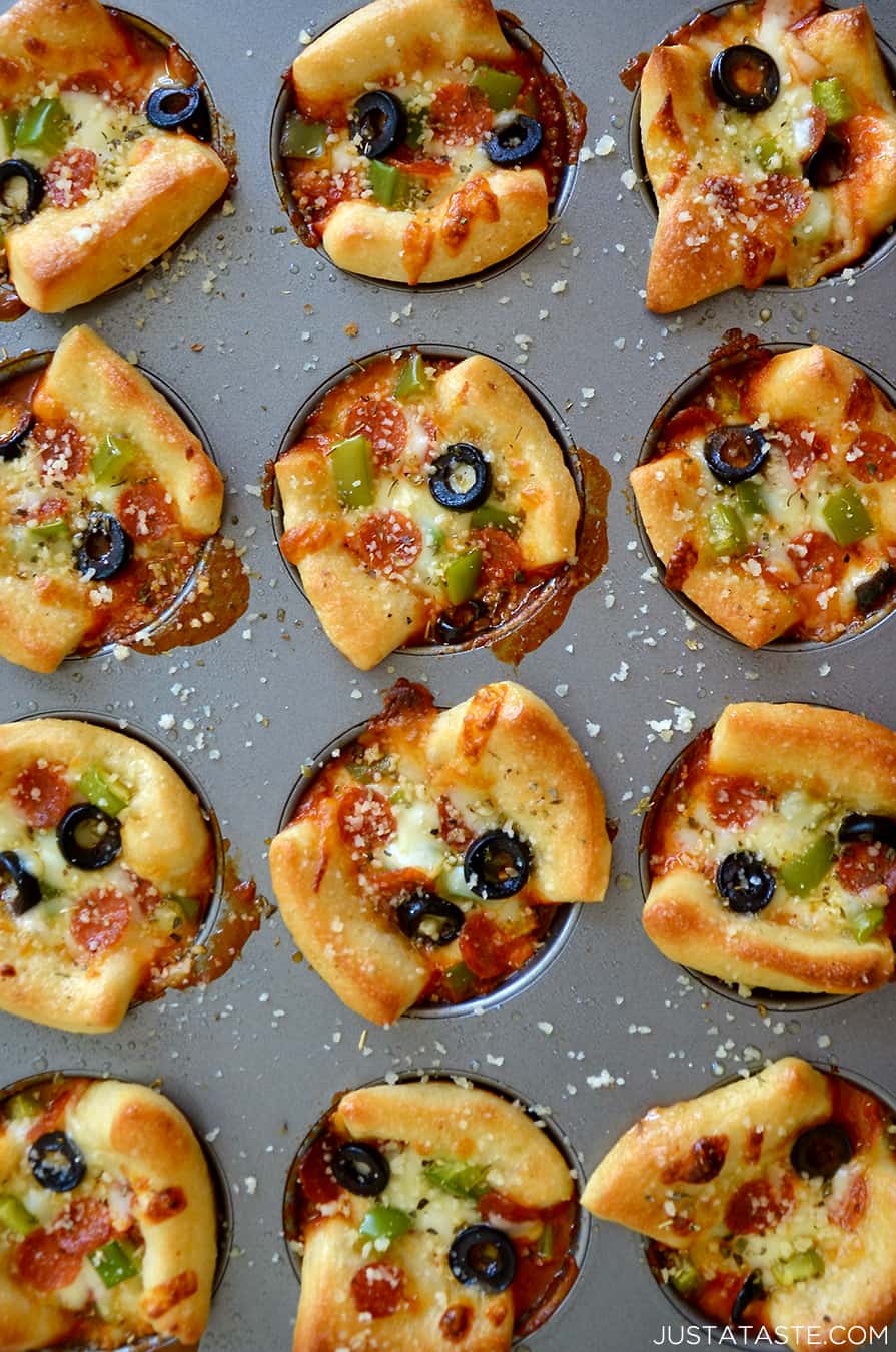 A close-up view of Easy Cheesy Pizza Cups in a muffin tin  