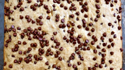 A top-down view of banana bars topped with chocolate chips