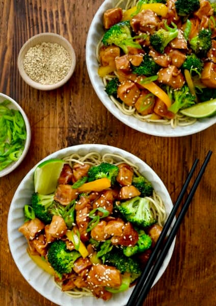 Chicken and broccoli stir-fry served over noodles.