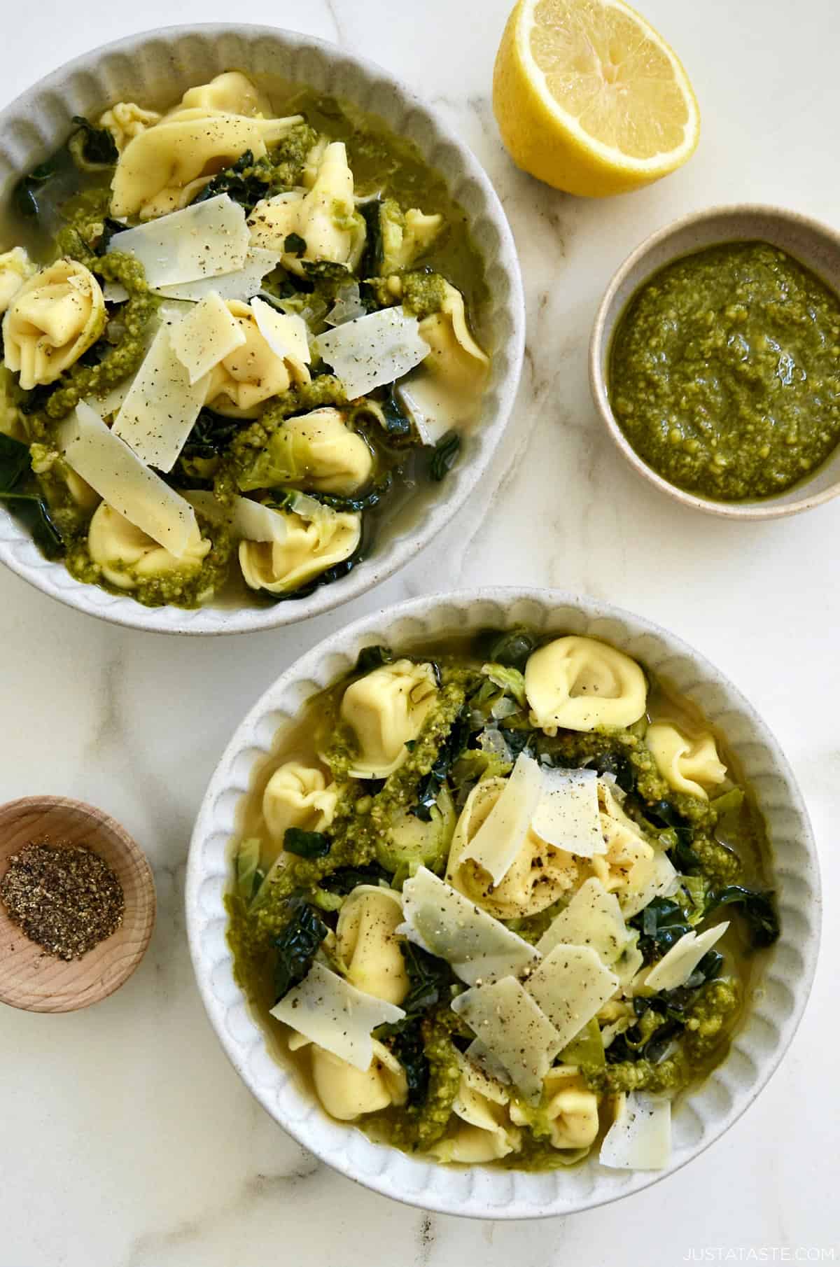 Tortellini soup with kale and Brussels sprouts in a Parmesan-infused broth drizzled with pesto.