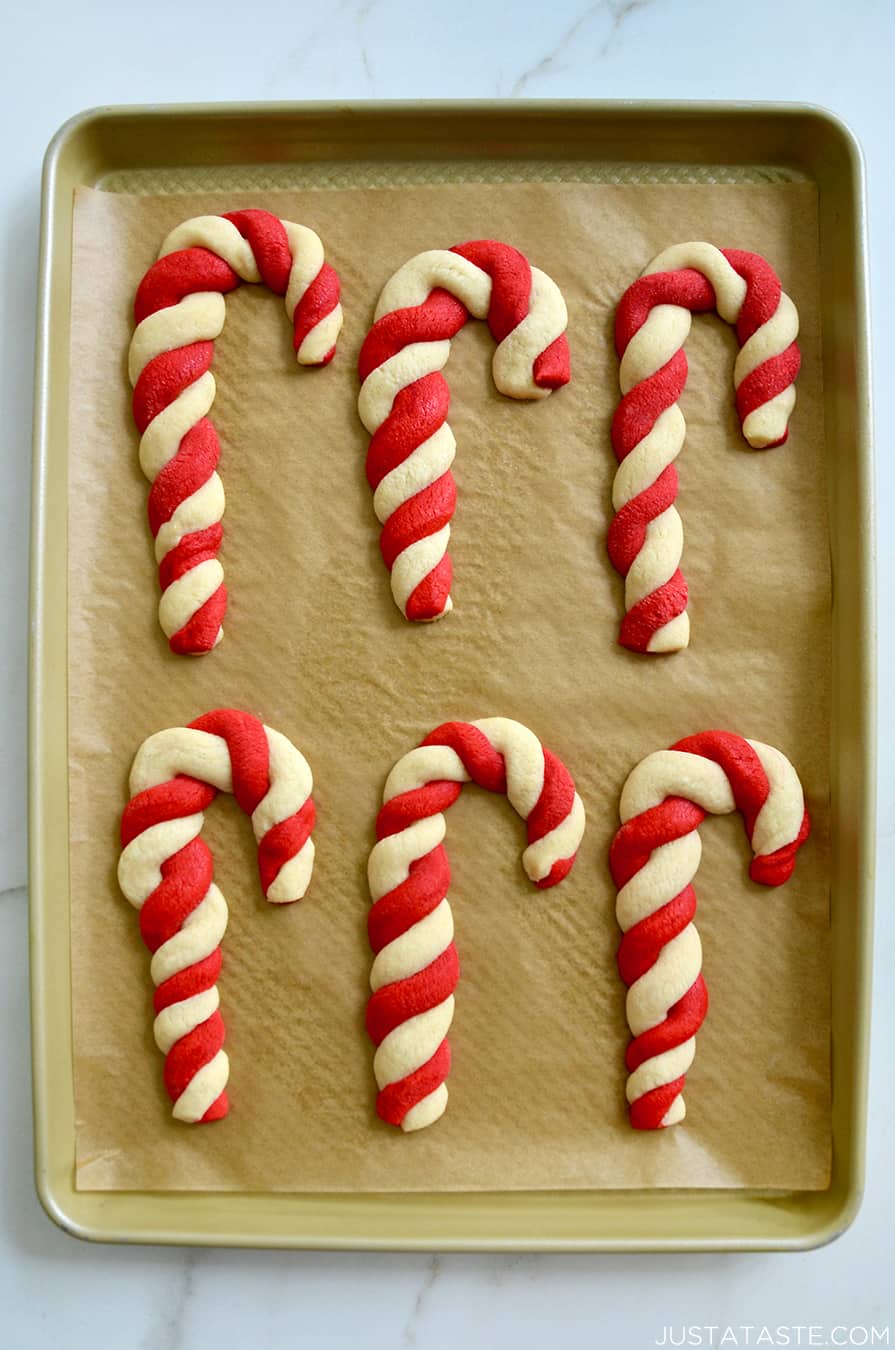 Homemade Candy Cane Cookies on a parchment paper-lined baking sheet