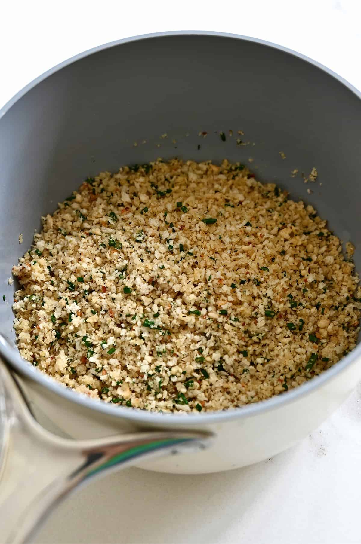Panko breadcrumbs, chopped fresh chives and butter in a saucepan.