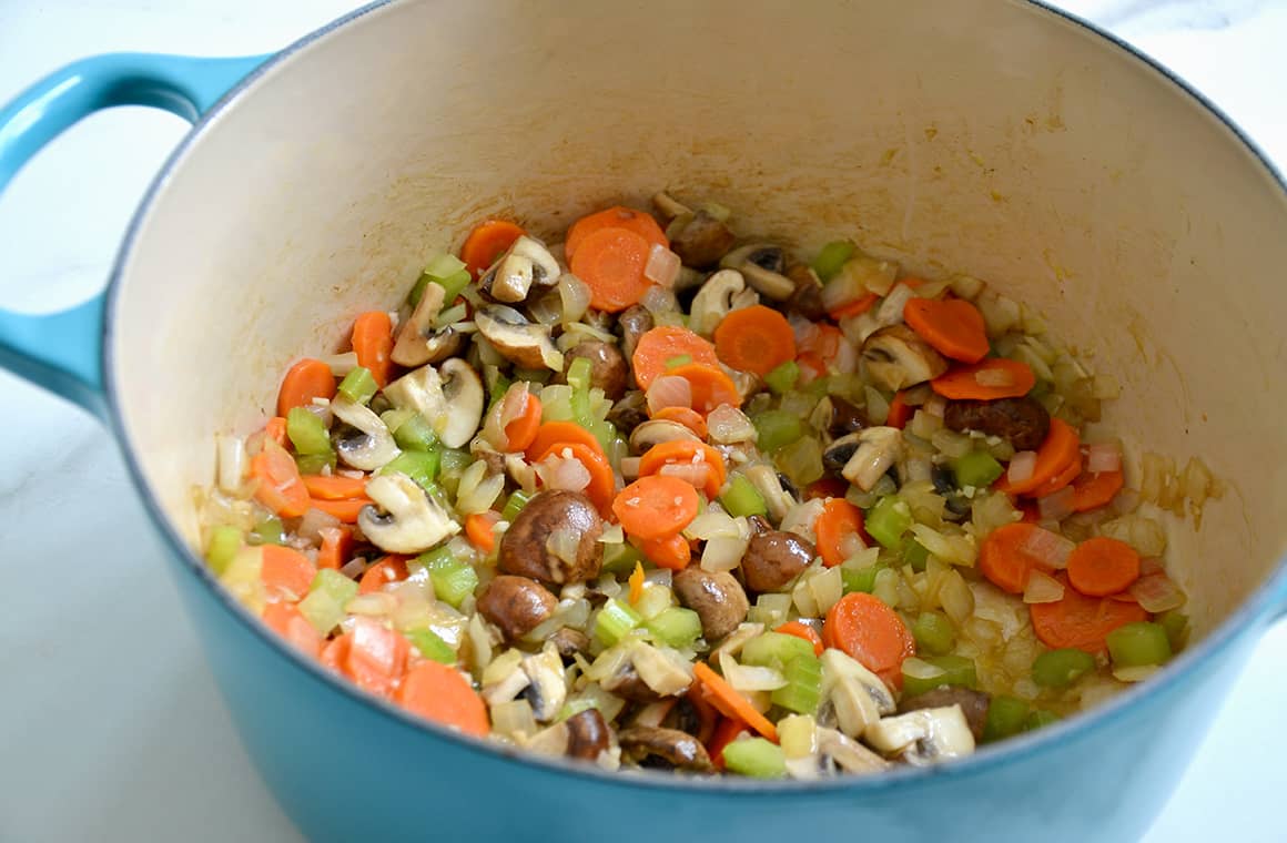 A heavy stock pot containing mirepoix