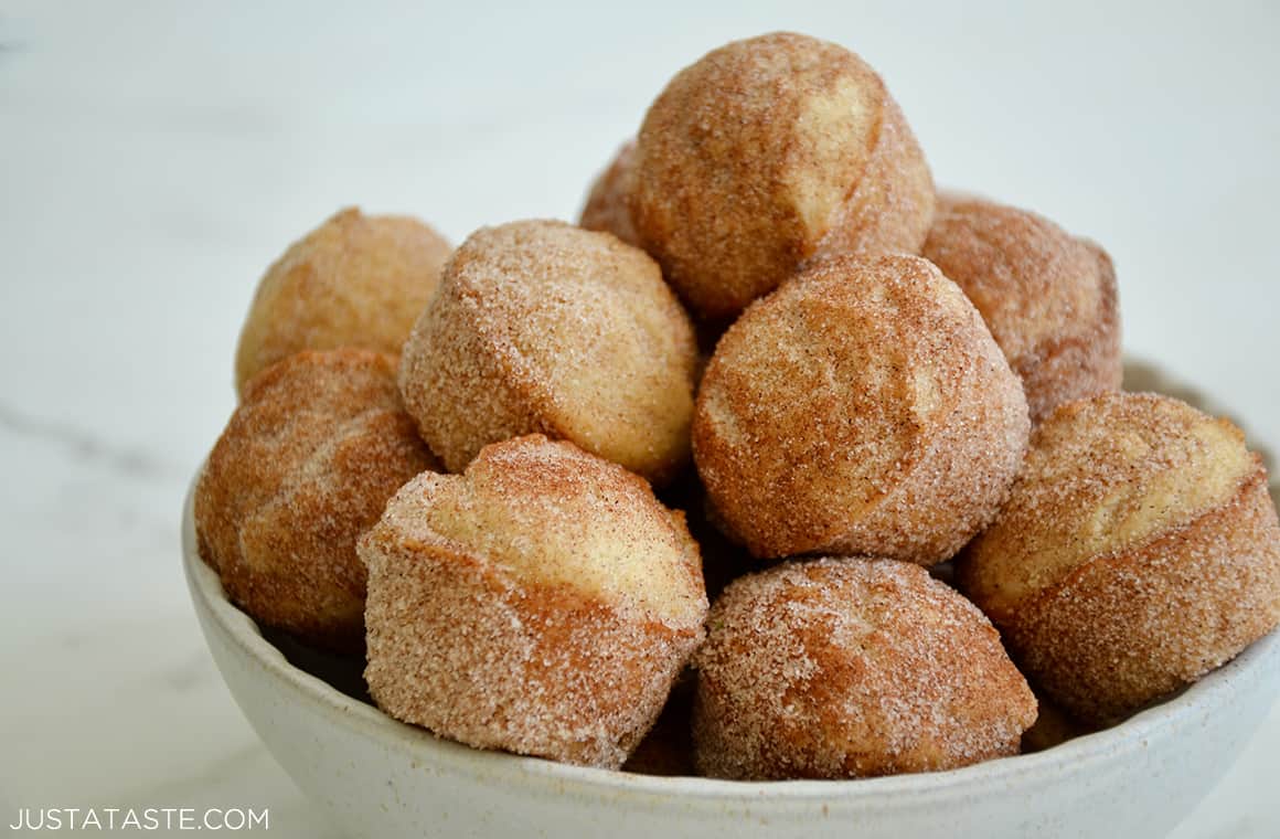 Churro Mini Sour Cream Doughnut Muffins in a white bowl