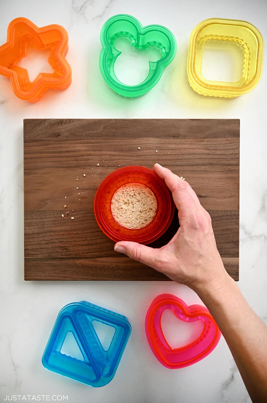 A top down view of making Homemade Uncrustables with a cookie cutter