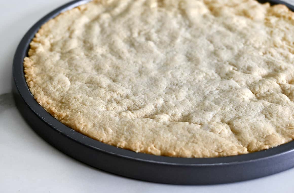 Lightly golden crust on a round baking sheet