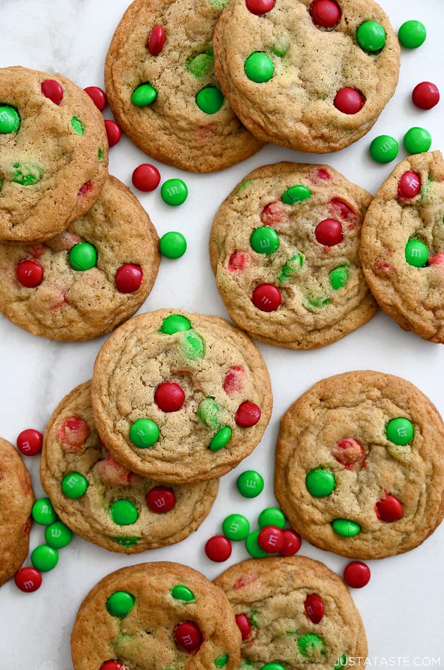 A top-down view of soft and chewy M&M cookies studded with red and green M&Ms