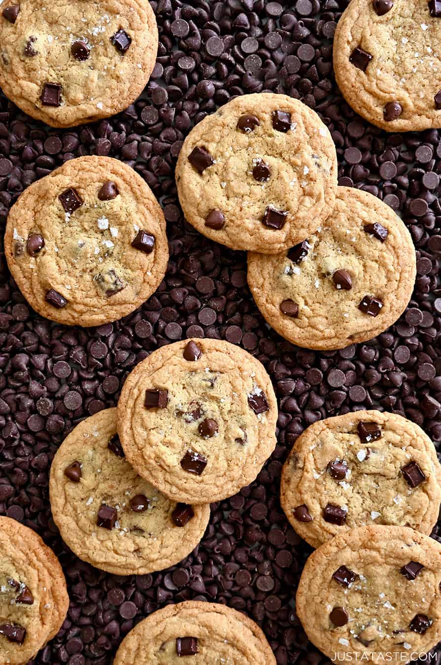 A top-down view of No-Chill Chocolate Chip Cookies atop a bed of chocolate chips