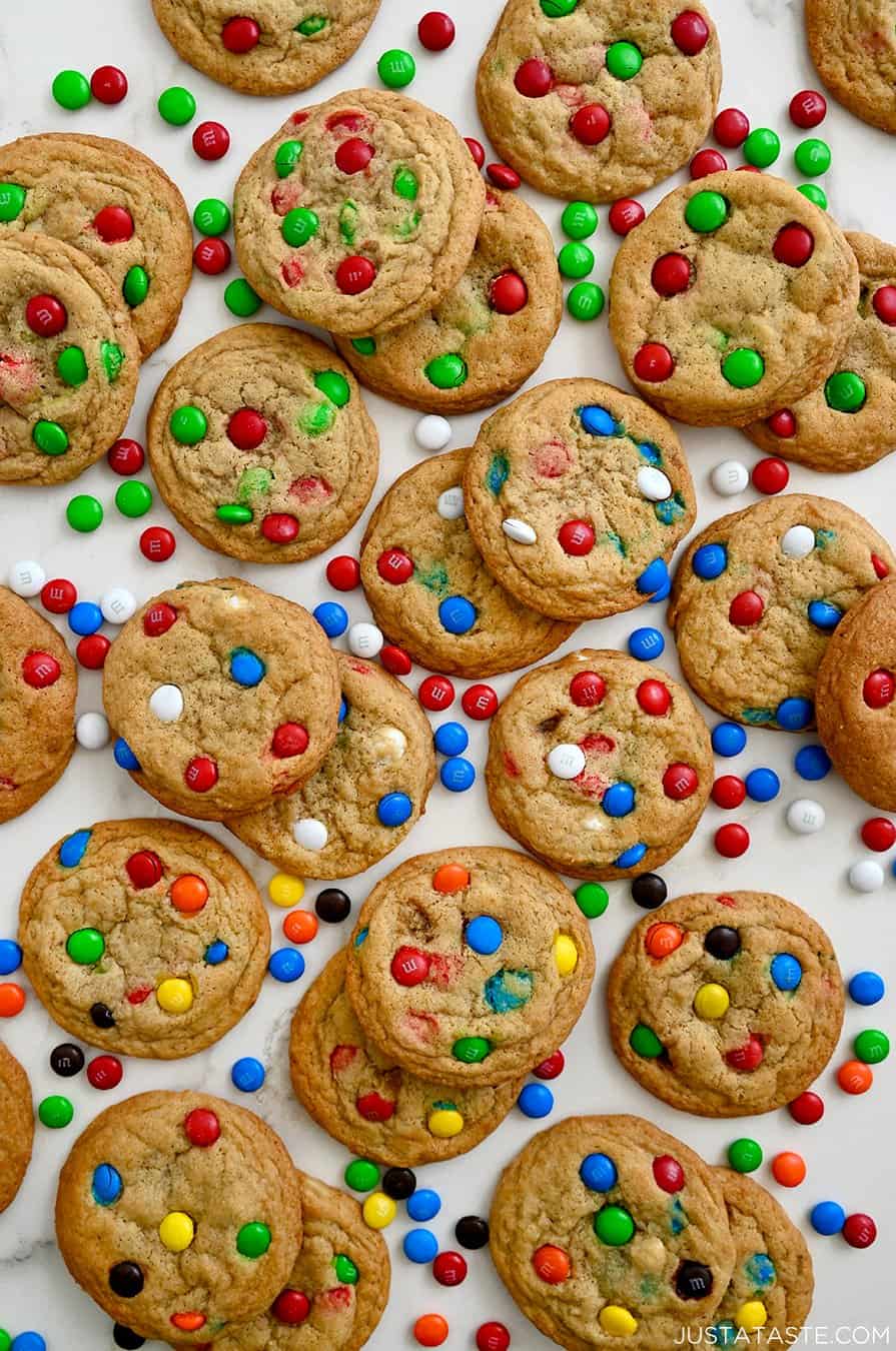 A top-down view of Soft and Chewy M&M Cookies studded with various colors of the candy-coated chocolates