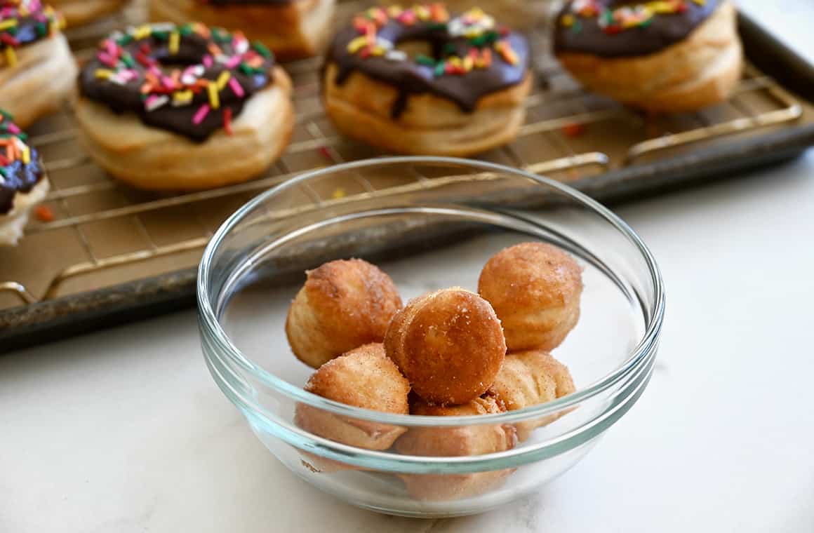 A clear bowl containing air fryer doughnut holes