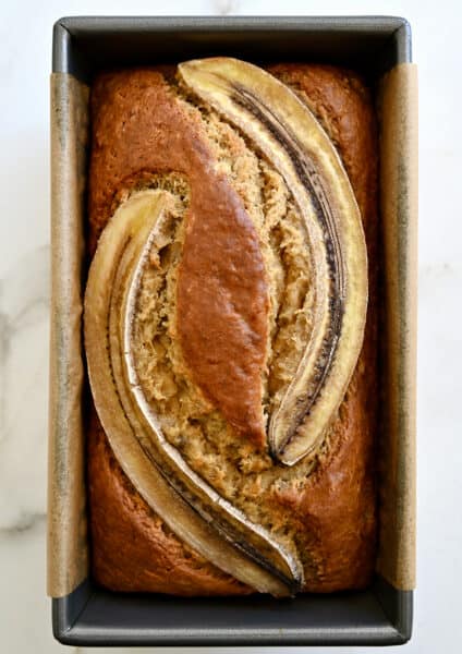 A top-down view of the best Brown Butter Banana Bread topped with two banana slices