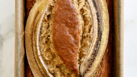 A top-down view of the best Brown Butter Banana Bread topped with two banana slices