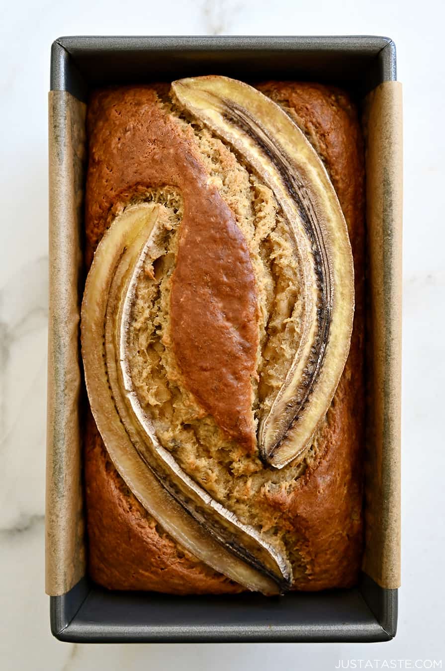 A top-down view of the best Brown Butter Banana Bread topped with two banana slices