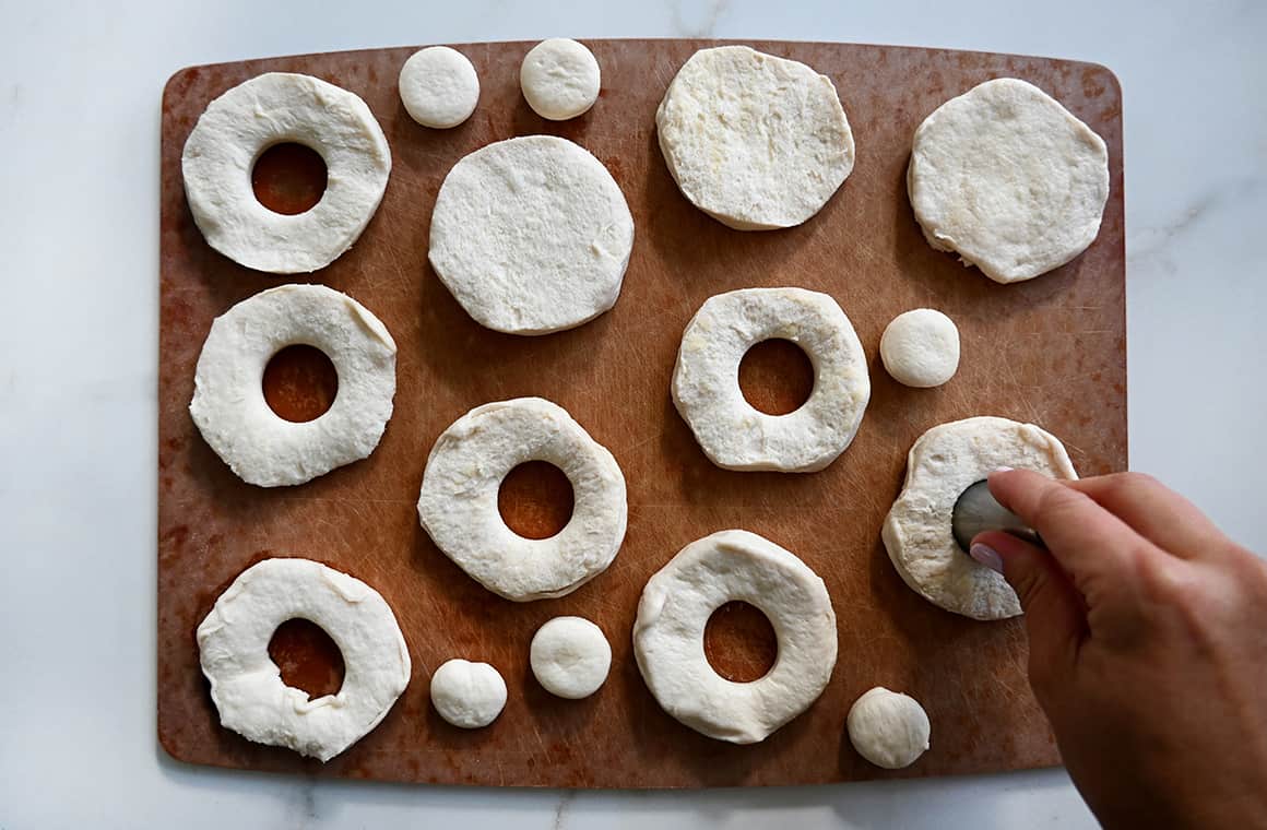 A top-down view of canned refrigerated dough with cutout centers