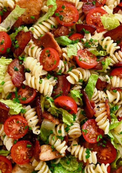 BLT pasta salad with a light red wine dressing and chopped fresh chives.