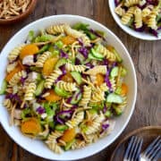 A top-down view of Chinese Chicken Pasta Salad with crunchy lo mein noodles in a white bowl.