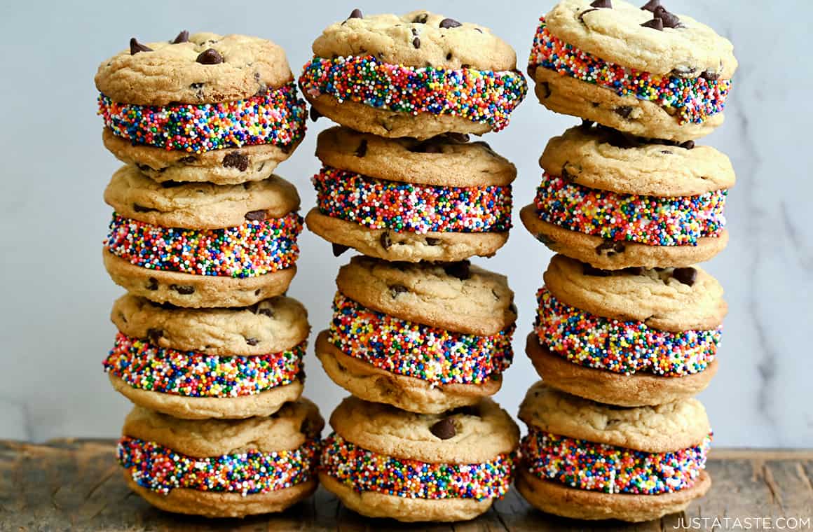 Three rows of stacked ice cream cookie sandwiches studded with rainbow sprinkles