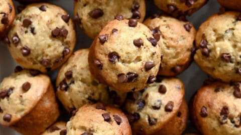 A close-up view of mini banana muffins studded with mini chocolate chips