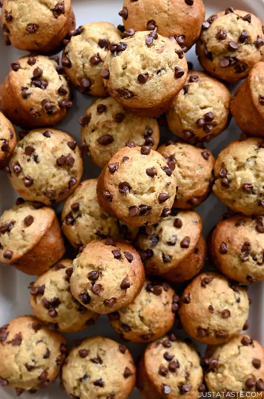 A close-up view of mini banana muffins studded with mini chocolate chips