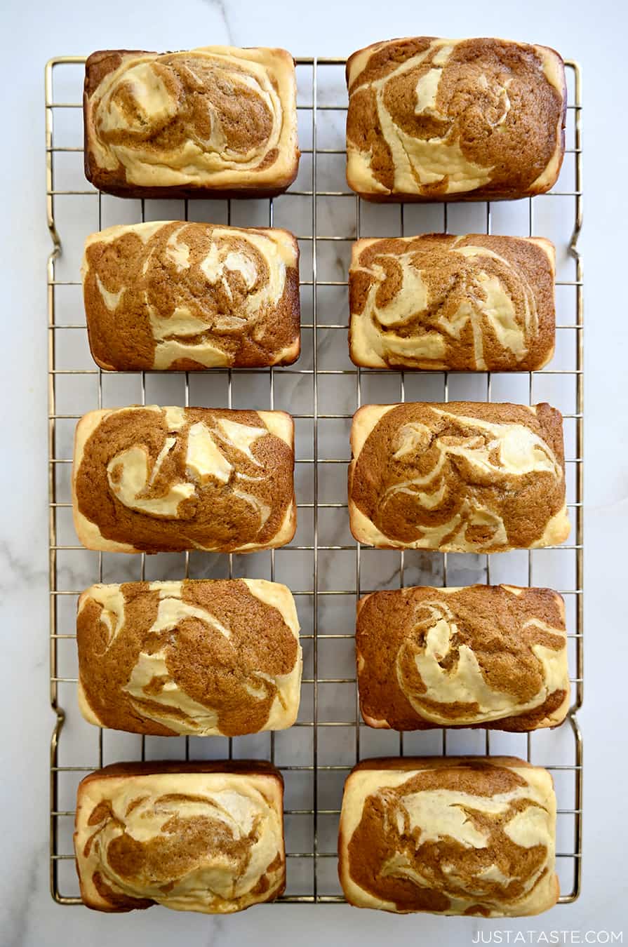 A top-down view of Pumpkin Cream Cheese Mini Loaves cooling on a wire rack