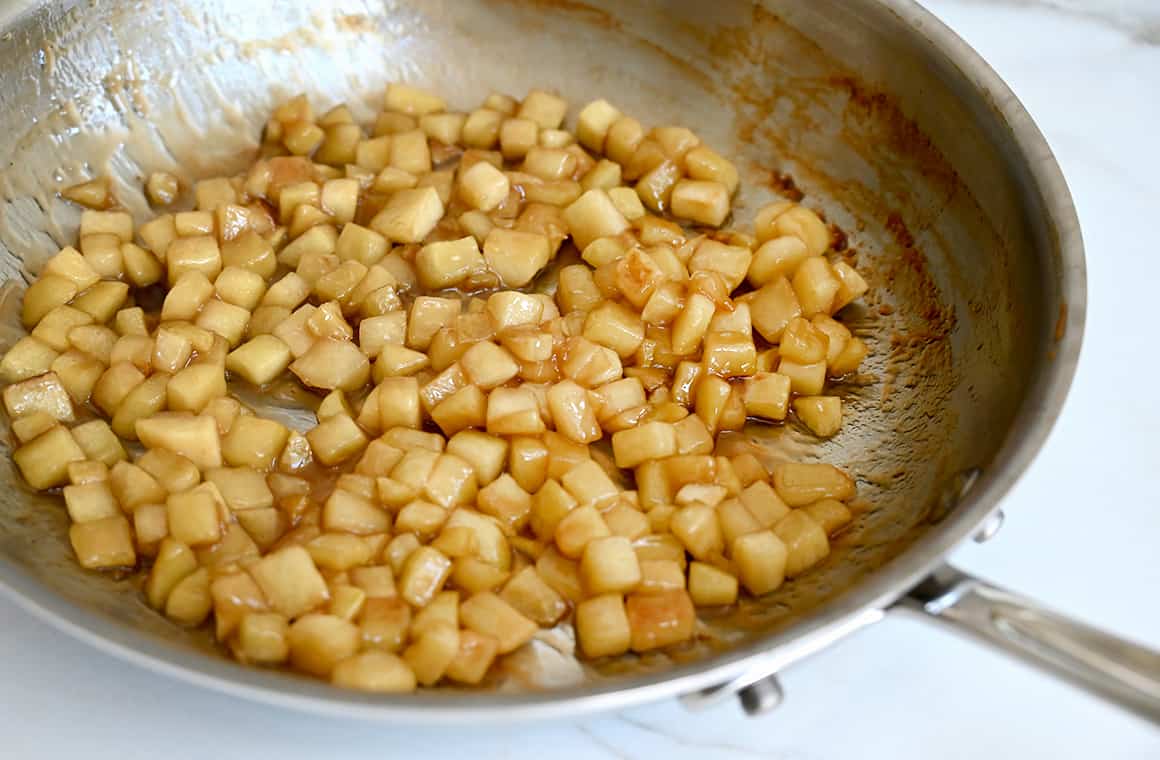 Diced apples in a sauté pan