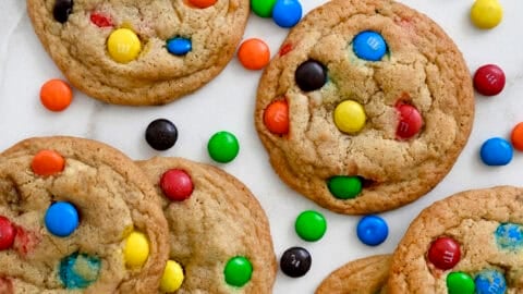 Thick and chewy soft baked M&M cookies studded with a rainbow of chocolate-coated candy.