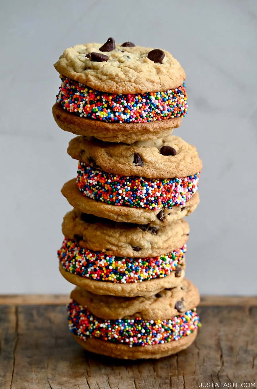 A stack of ice cream cookie sandwiches coated in rainbow sprinkles