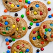 A top-down view of rainbow M&M's cookies.